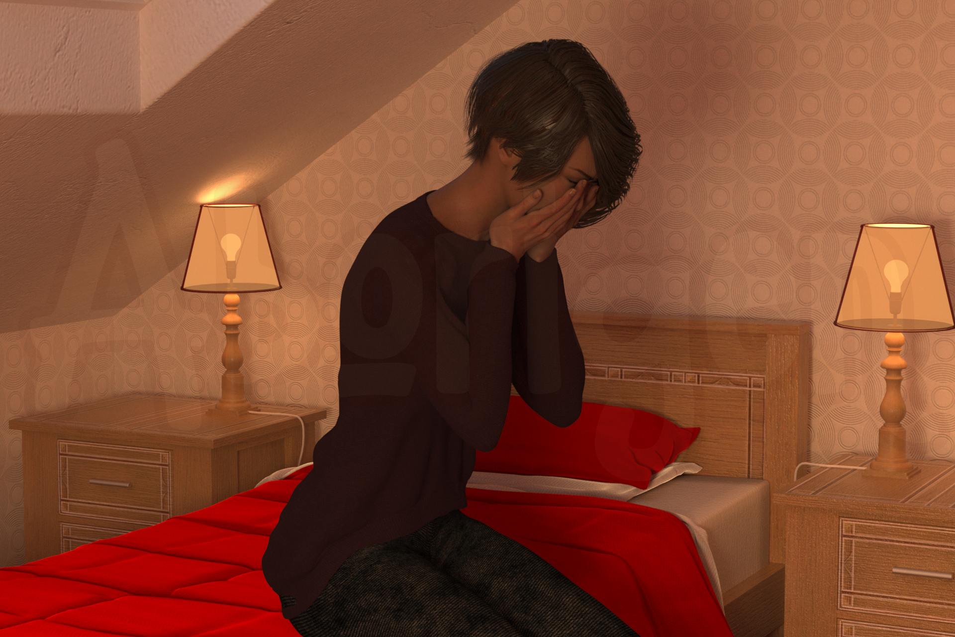 A woman in a burgundy sweater and black jeans is sittng on the edge of her bed, covering her face and sobbing.